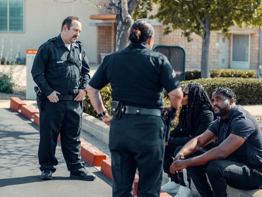Police officers talking with members of the community