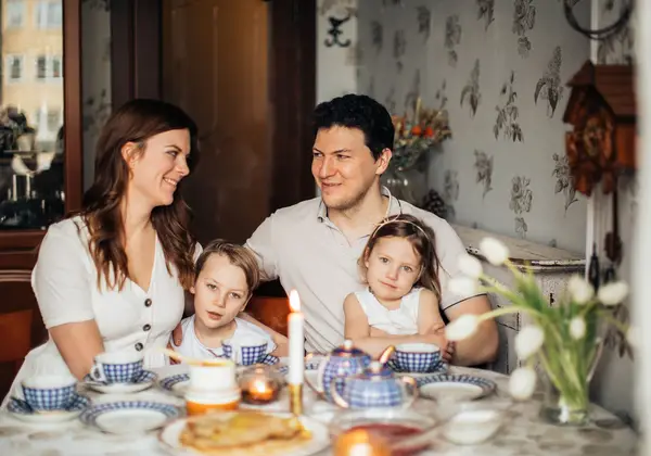 A Russian family gathered around the table