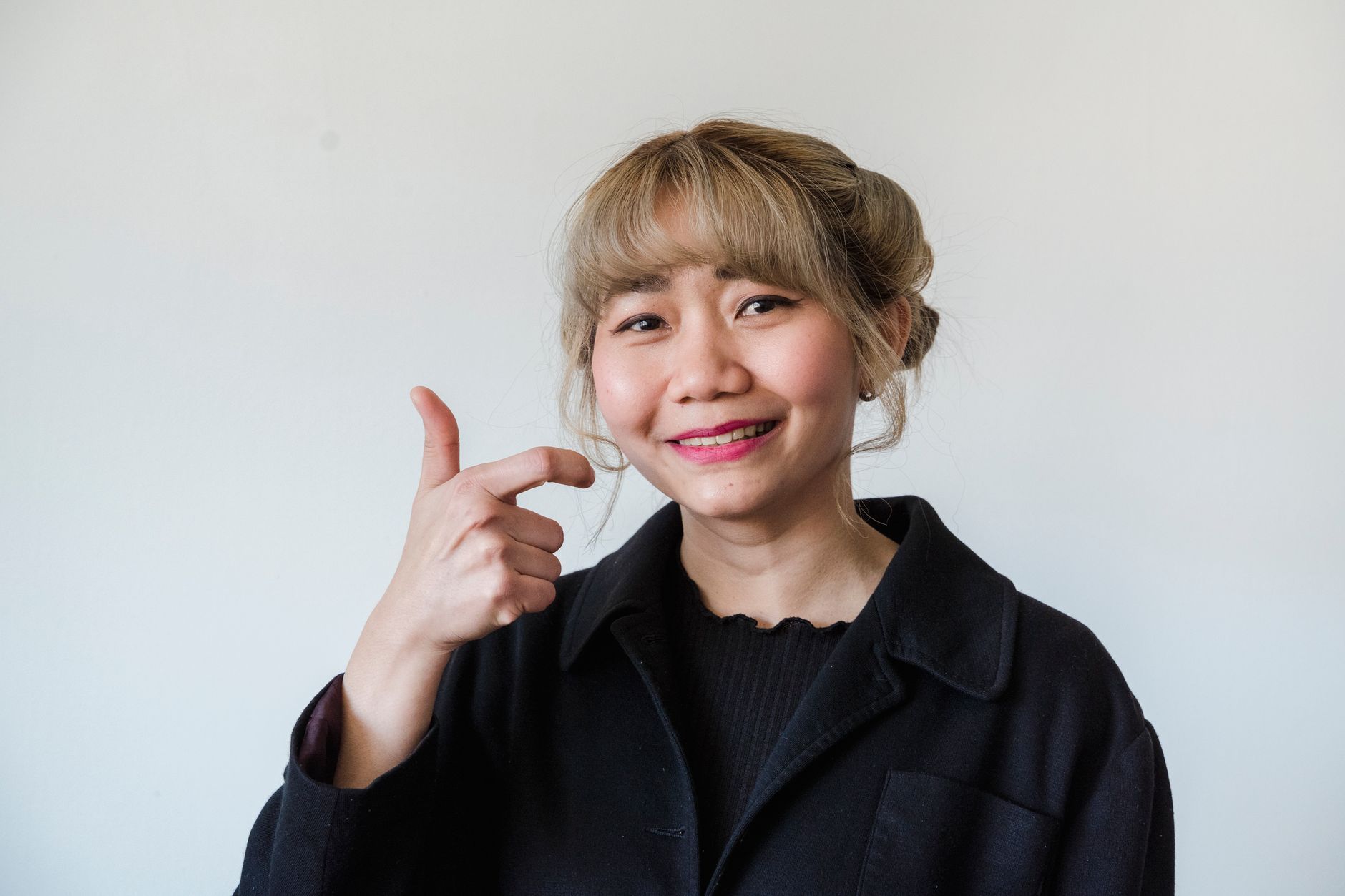 A smiling Asian American woman