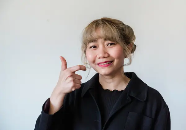 A smiling Asian American woman