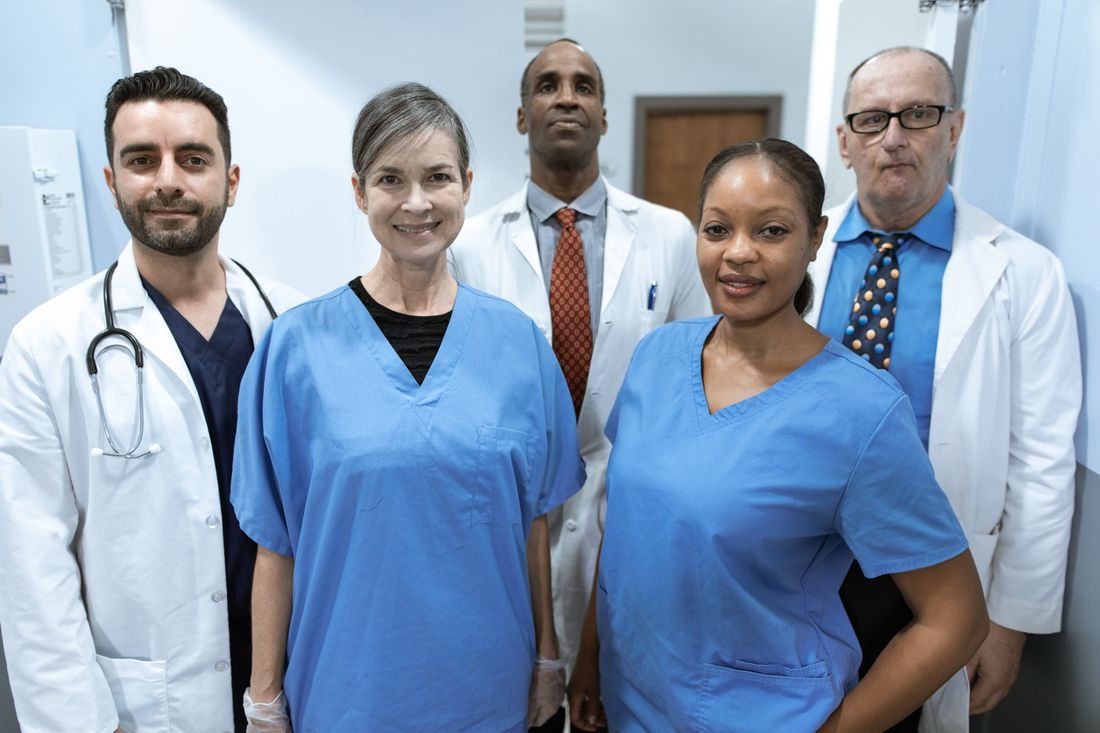 A diverse team of nurses and doctors in a hospital corridor