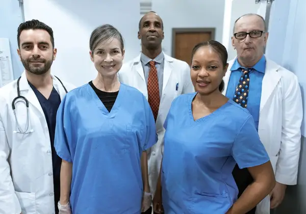 A diverse team of nurses and doctors in a hospital corridor