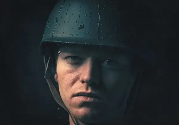 A soldier's resolute face, carrying what most will never see