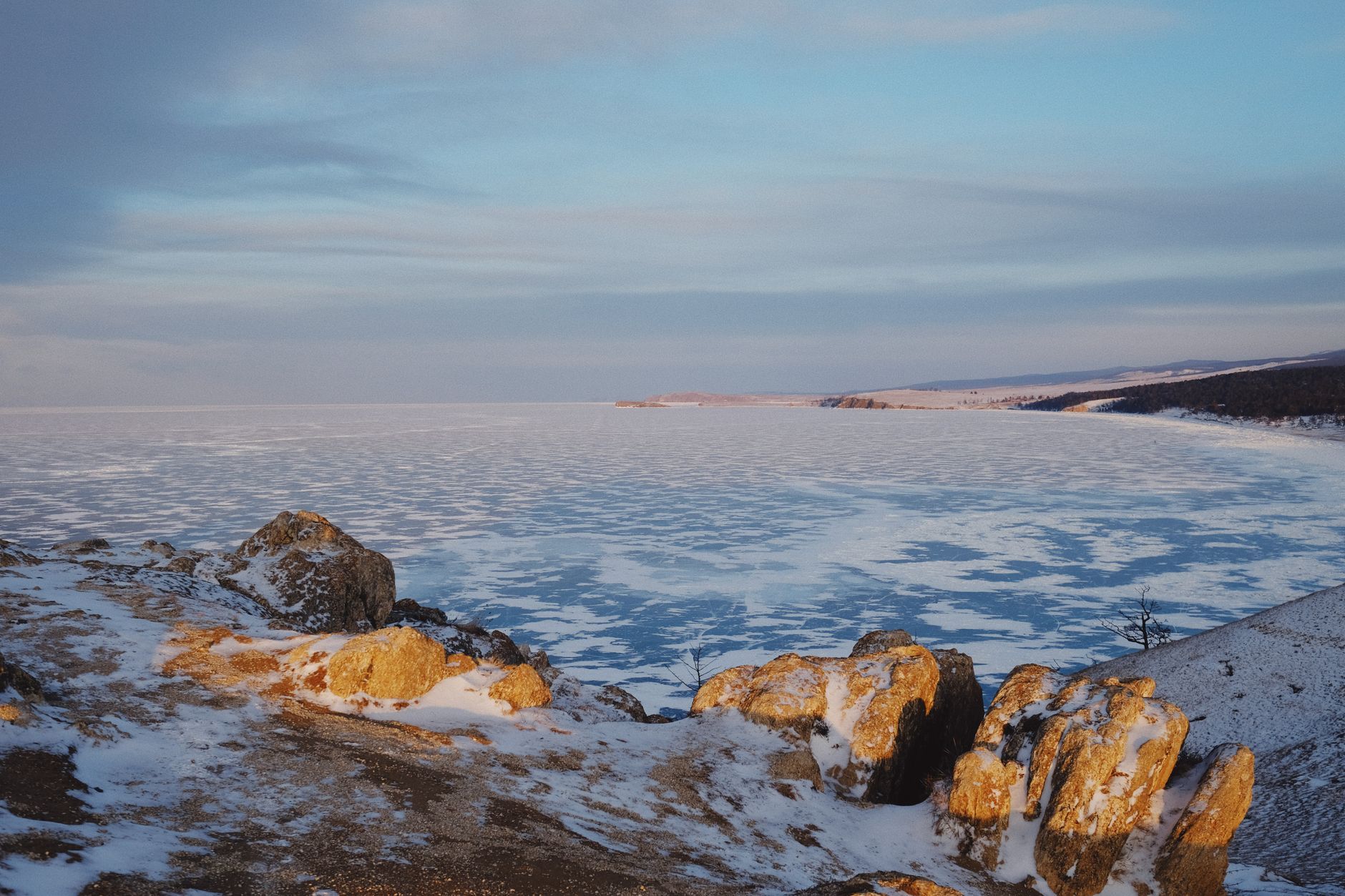 Frozen Lake Baikal at sunset