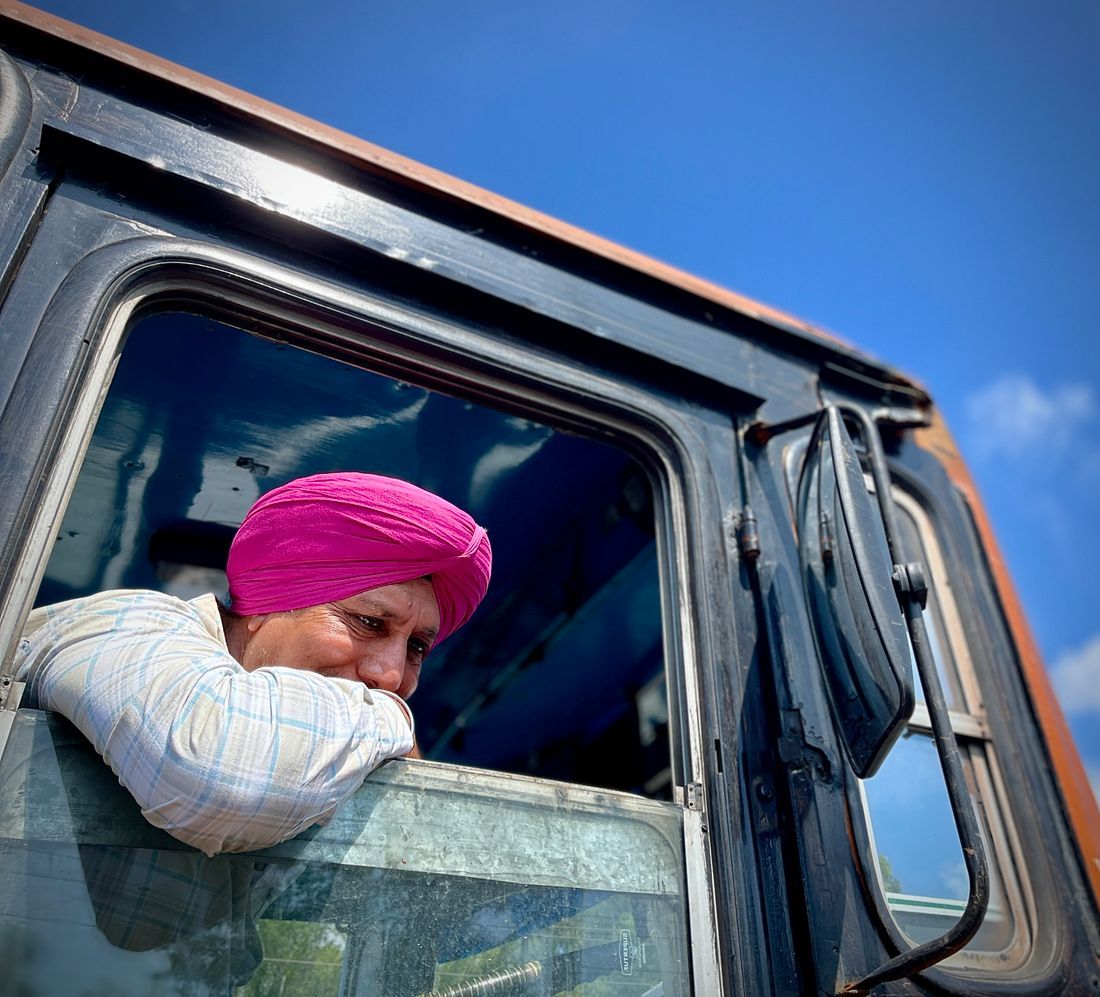 A man resting in a thoughtful, quiet moment