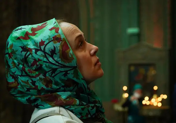 A Russian woman praying in an Orthodox church