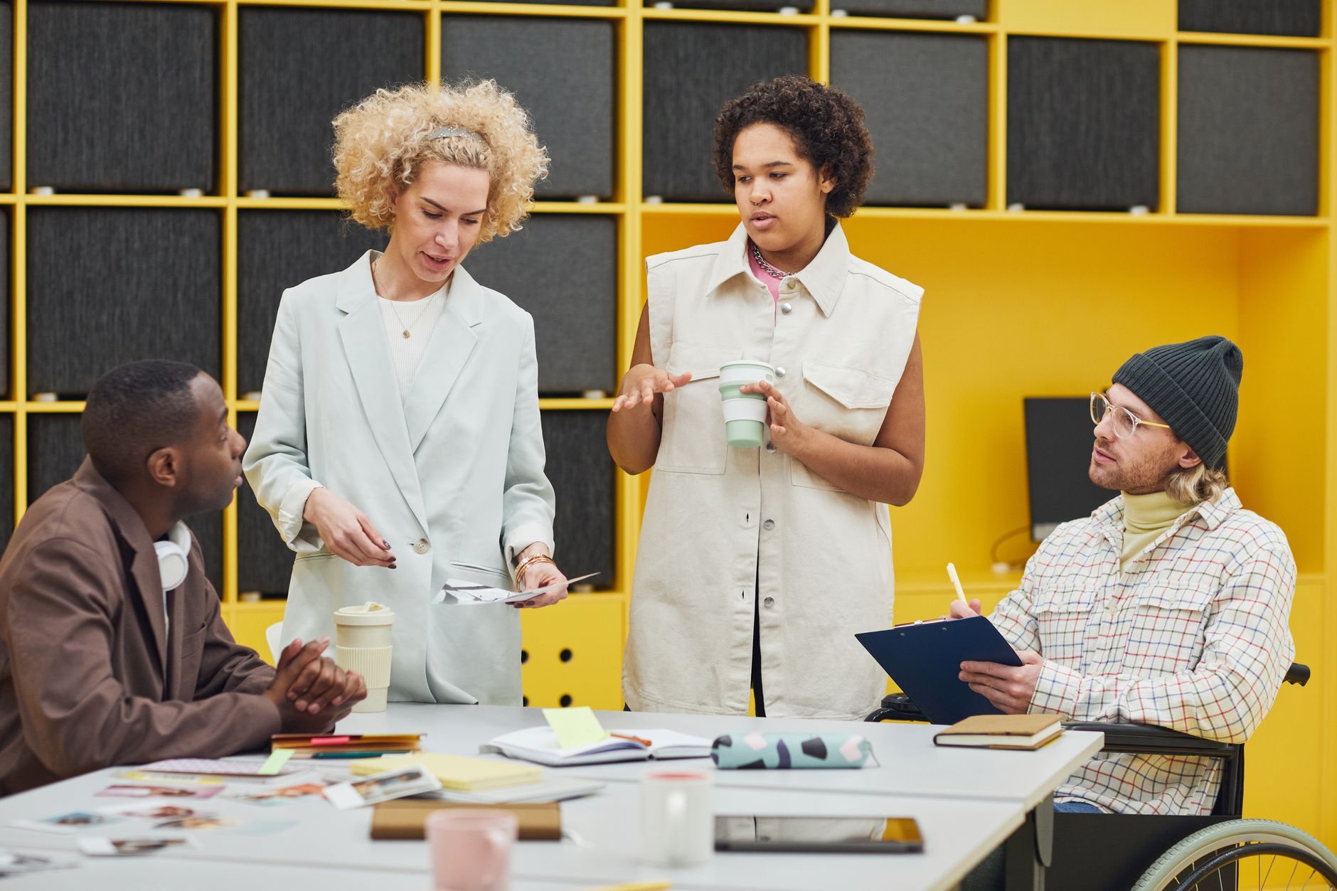 An inclusive team meeting, including a colleague using a wheelchair
