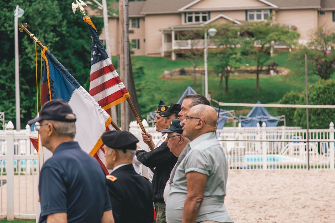 A veteran color guard carrying the flag at a ceremony