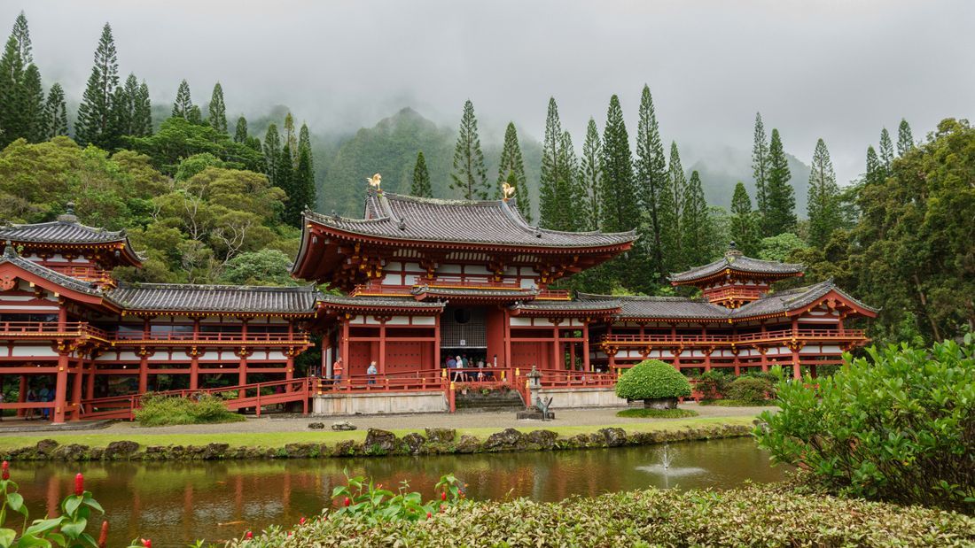 A serene temple set against misty mountains