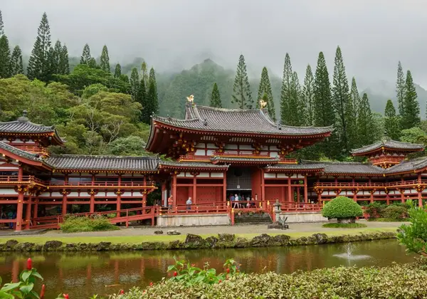 A serene temple set against misty mountains