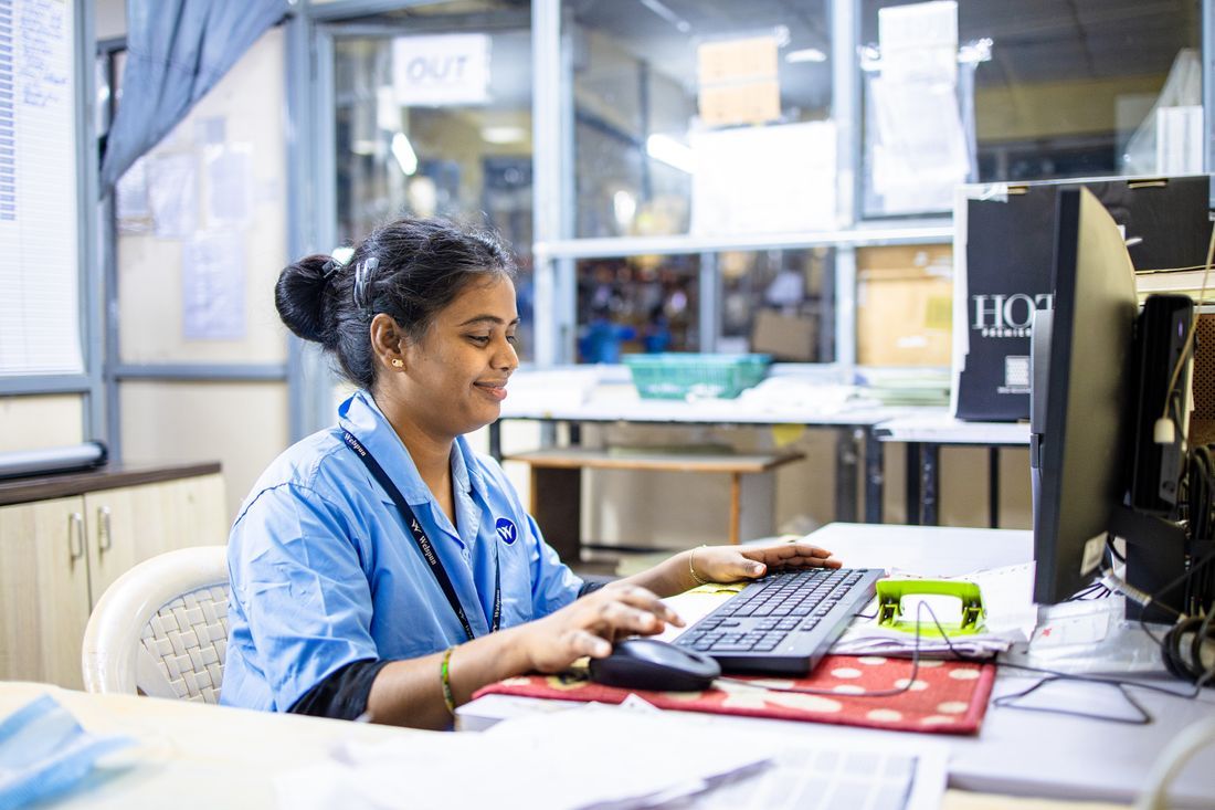 A church office worker at a computer keeping the ministry running