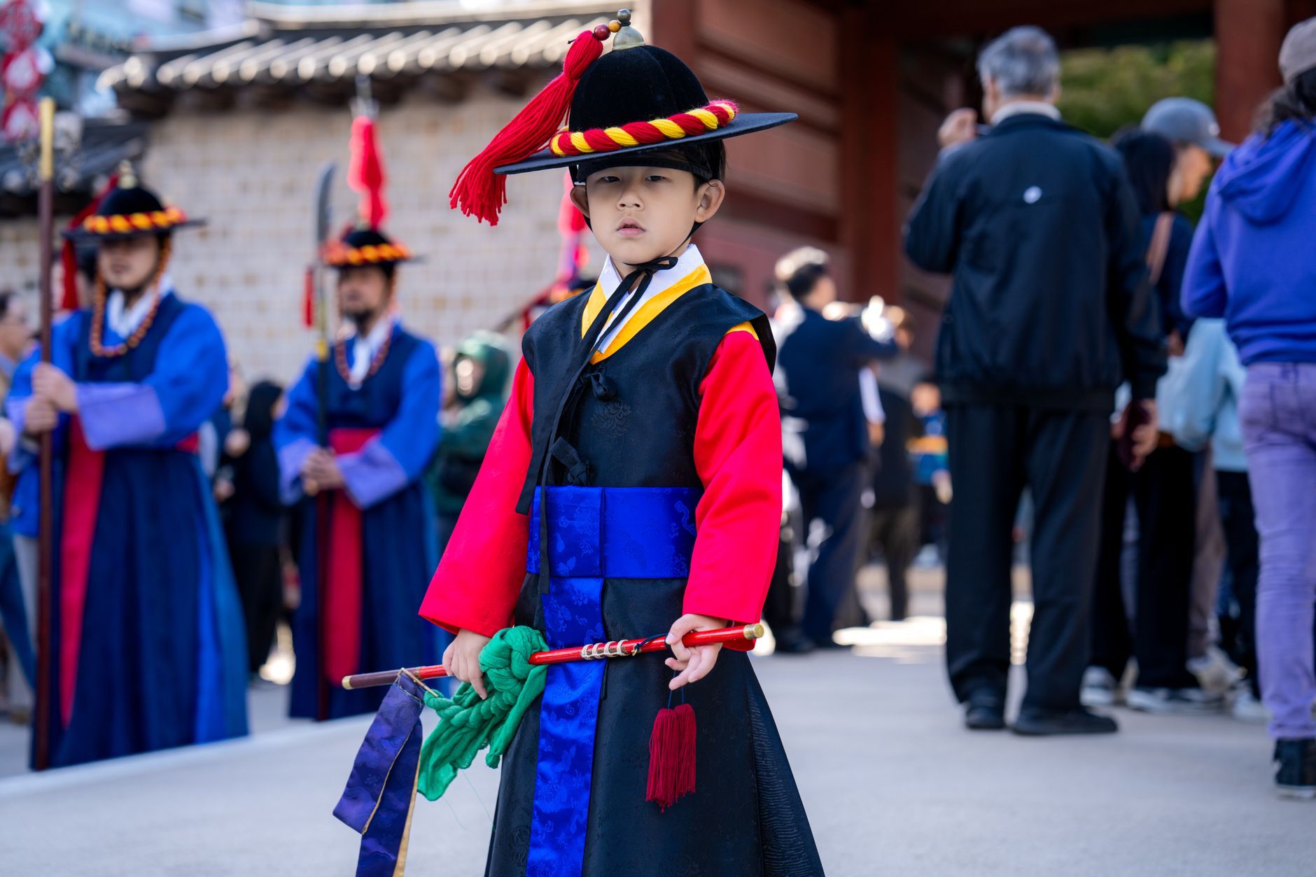A Korean boy in traditional guard costume at a palace