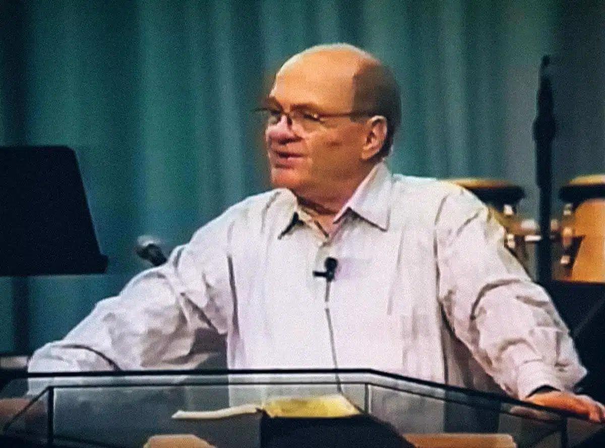 Jack Winter teaching from a podium — the forerunner of the modern Father-heart movement, who received the revelation of our Father's love in 1977 and carried it across more than thirty nations until his death in 2002.