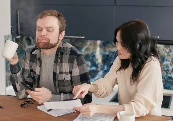 A couple working through their bills together