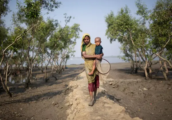 A mother and child in the Sundarbans mangroves of Bangladesh