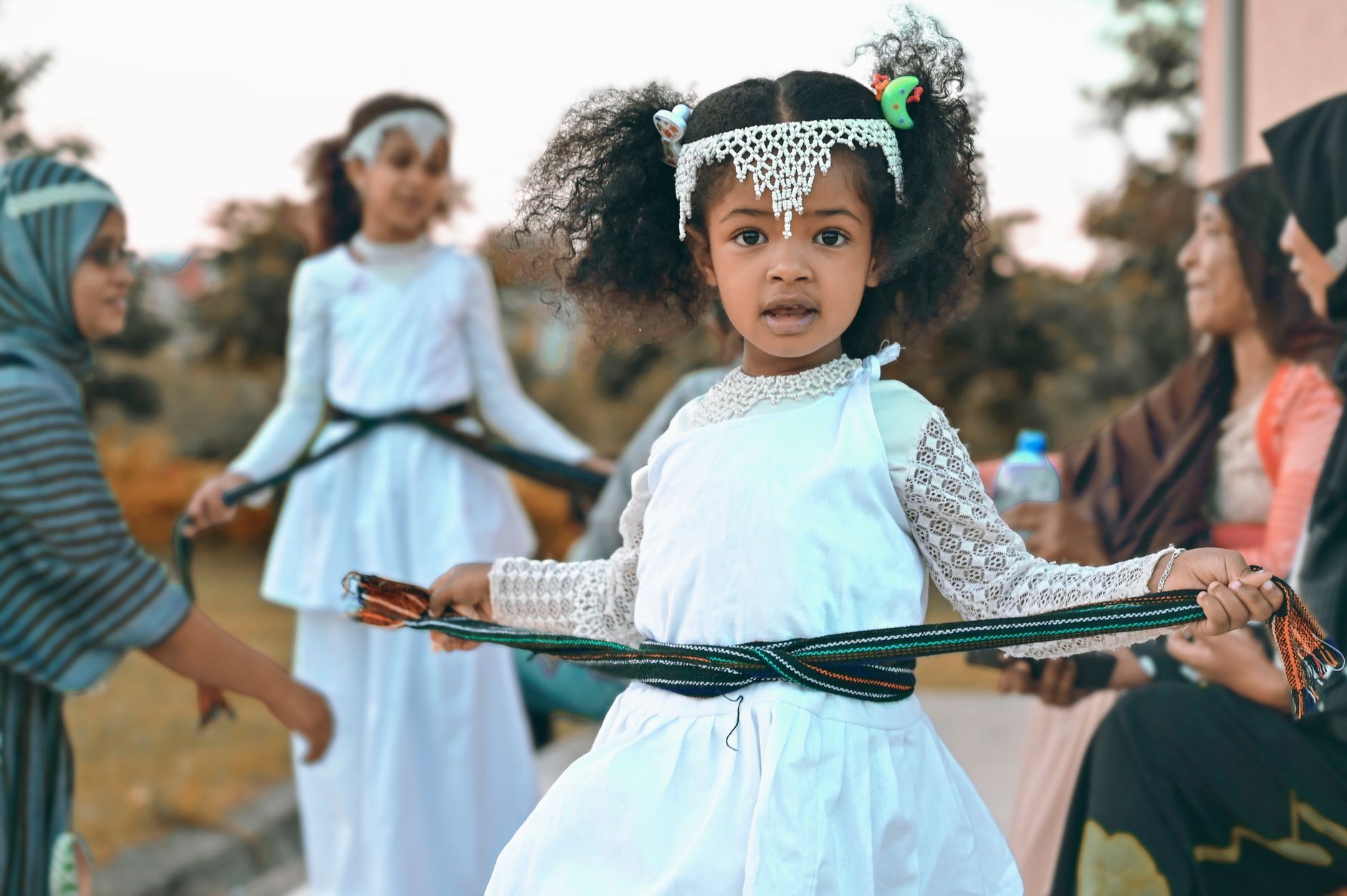 A young Ethiopian girl in a white traditional dress