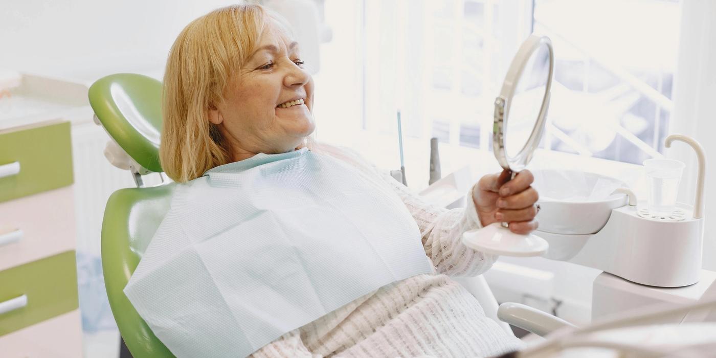 Smiling patient after dental implant treatment in Houston