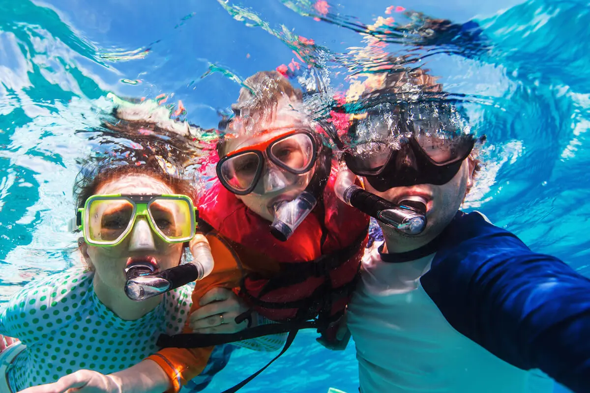 People using Diving Direct Snorkelling kits in the sea