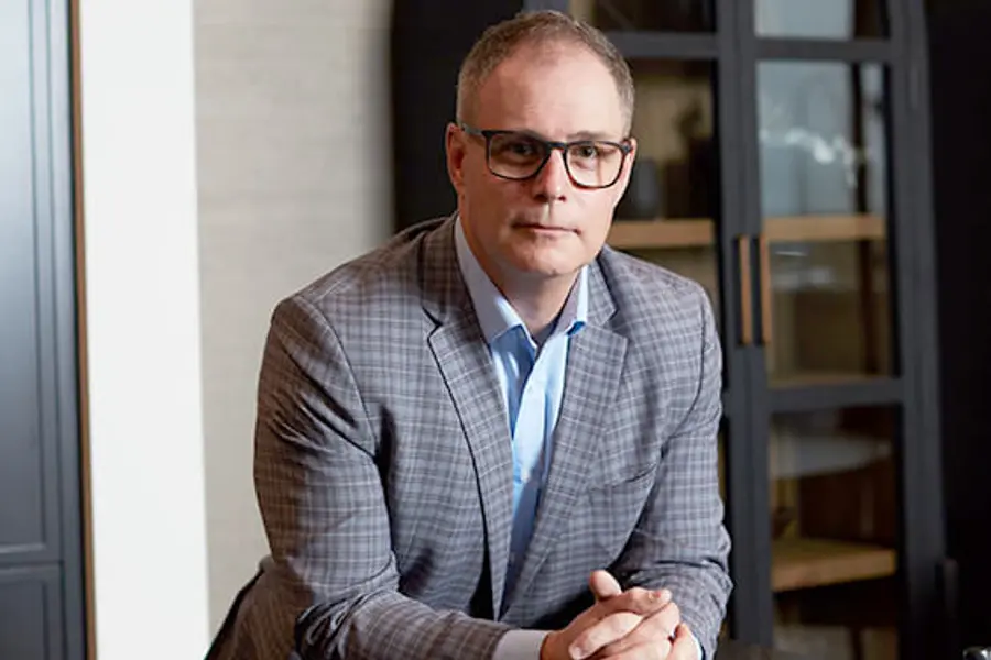 Mike Selinger posing in a Cardel Home.