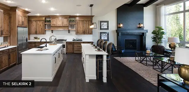 A kitchen with elegant wood cabinets and a charming fireplace, enhancing the room's warmth and character.