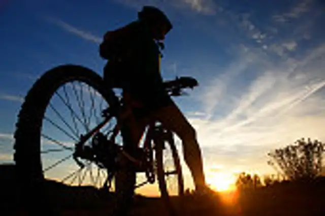 Man resting after mountain bike ride