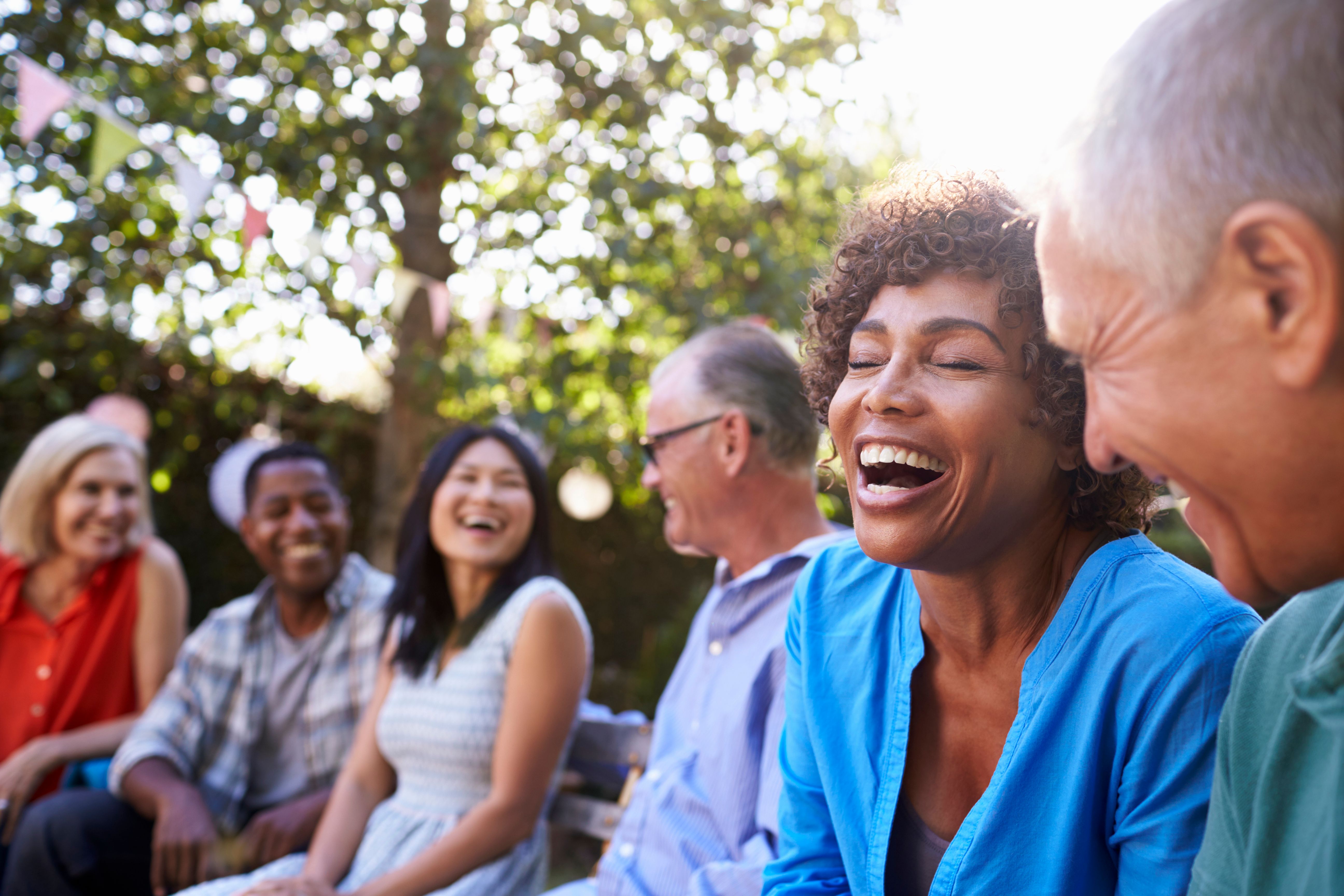 Residents enjoying conversation outdoors at North River Ranch in Parrish, Florida
