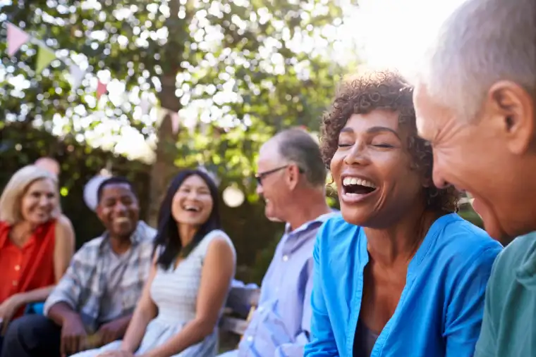 Residents enjoying conversation outdoors at North River Ranch in Parrish, Florida
