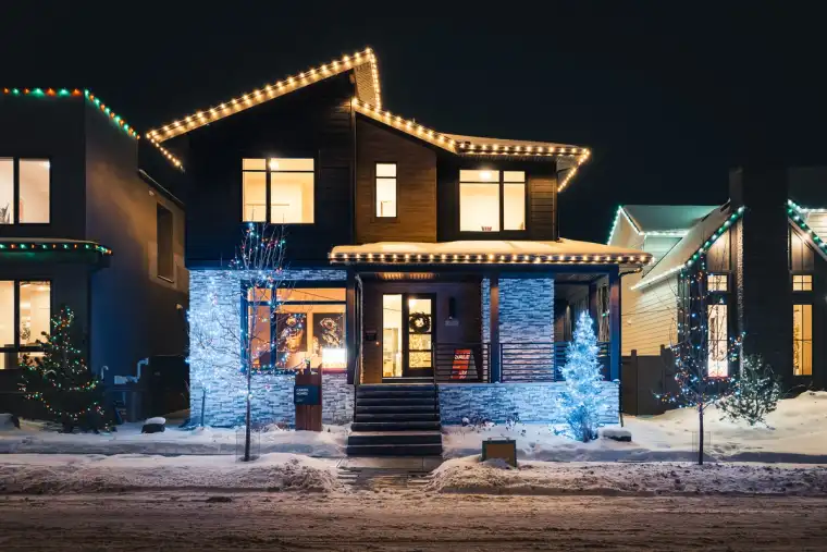 The Cardel Homes Alpine Park Calgary showhome decorated with Christmas lights at night