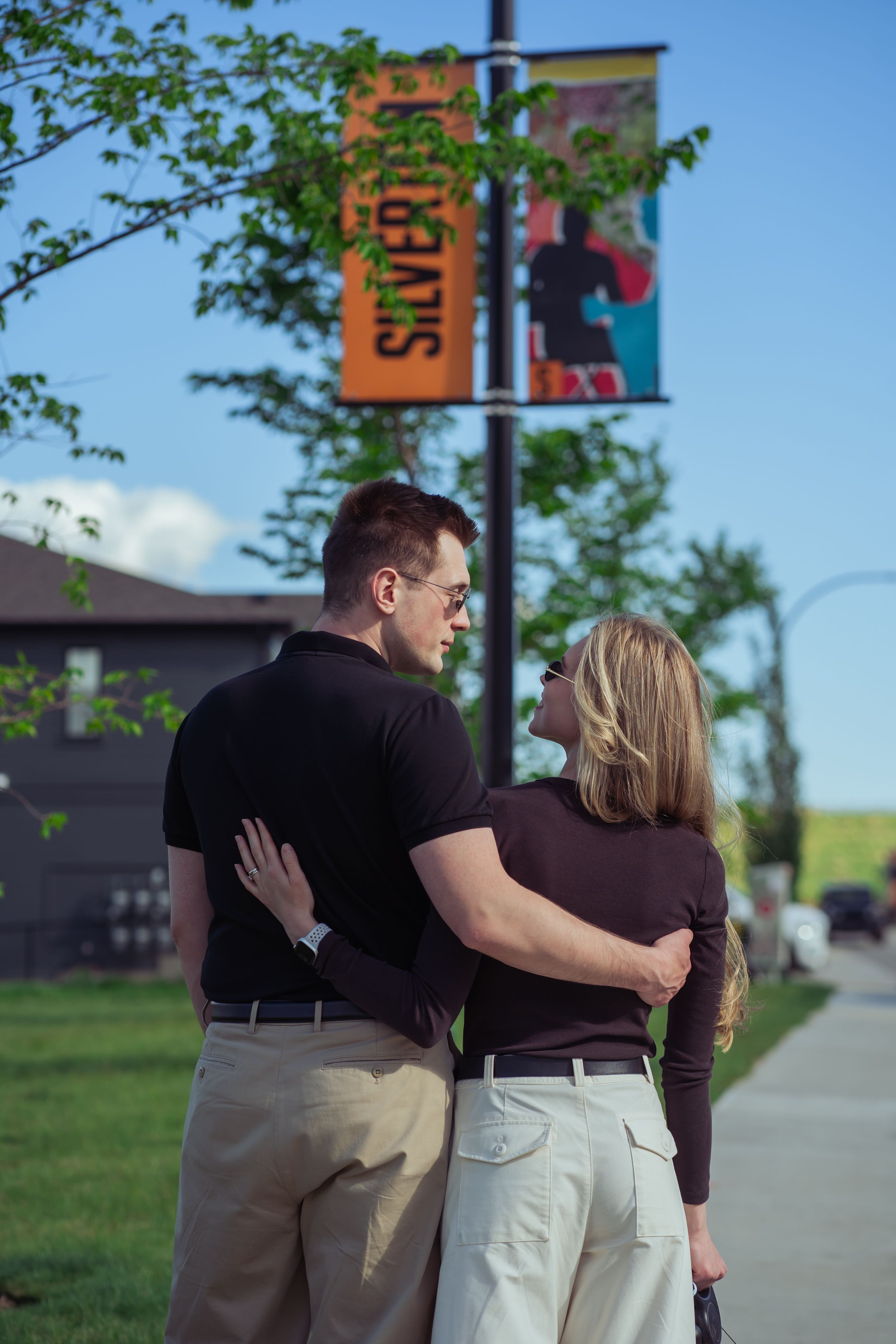Couple walking arm in arm through a Cardel Homes community.
