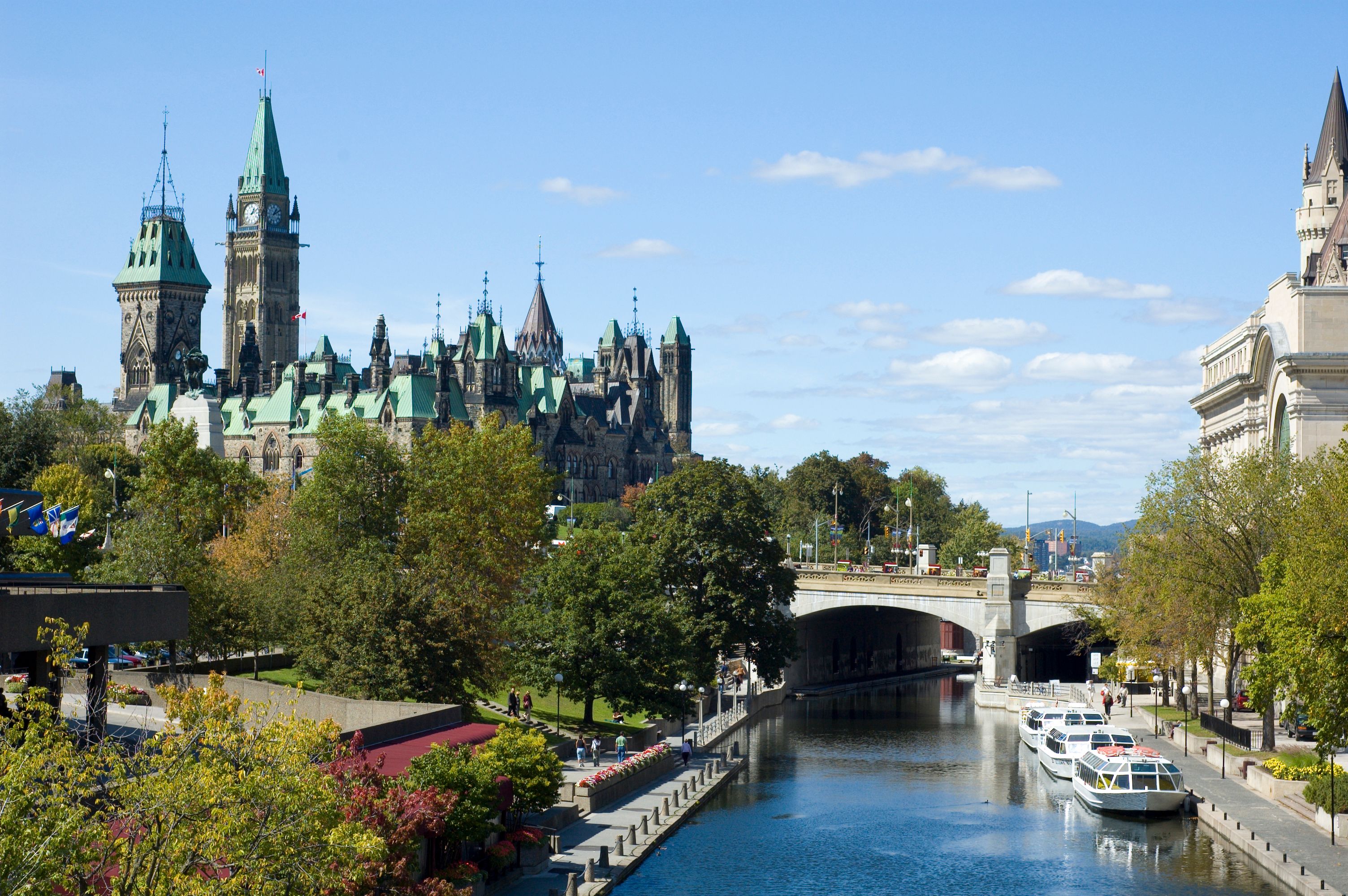 Ottawa skyline featuring Parliament Hill with its iconic Peace Tower, overlooking the Rideau Canal with boats, a bridge, and tree-lined pathways under a clear blue sky.​​​​‌﻿‍﻿​‍​‍‌‍﻿﻿‌﻿​‍‌‍‍‌‌‍‌﻿‌‍‍‌‌‍﻿‍​‍​‍​﻿‍‍​‍​‍‌﻿​﻿‌‍​‌‌‍﻿‍‌‍‍‌‌﻿‌​‌﻿‍‌​‍﻿‍‌‍‍‌‌‍﻿﻿​‍​‍​‍﻿​​‍​‍‌‍‍​‌﻿​‍‌‍‌‌‌‍‌‍​‍​‍​﻿‍‍​‍​‍​‍﻿﻿‌‍​‌‌‍‌​‌‍﻿‌‌‍‍‌‌‍﻿‍​‍﻿﻿‌﻿​﻿‌‍​‌‌‍﻿‍‌‍‍‌‌﻿‌​‌﻿‍‌​‍﻿﻿‌‍‍‌‌‍﻿‍‌﻿‌​‌‍‌‌‌‍﻿‍‌﻿‌​​‍﻿﻿‌‍‌‌‌‍‌​‌‍‍‌‌﻿‌​​‍﻿﻿‌‍﻿‌‌‍﻿﻿‌‍‌​‌‍‌‌​﻿﻿‌‌﻿​​‌﻿​‍‌‍‌‌‌﻿​﻿‌‍‌‌‌‍﻿‍‌﻿‌​‌‍​‌‌﻿‌​‌‍‍‌‌‍﻿﻿‌‍﻿‍​﻿‍﻿‌‍‍‌‌‍‌​​﻿﻿‌‌‍​‌‌‍‌​​﻿‌﻿‌‍​‍​﻿​​​﻿​﻿‌‍​﻿​﻿‌​​‍﻿‌‌‍​‌‌‍​‍‌‍​‍​﻿‍‌​‍﻿‌​﻿‌​​﻿‌‍​﻿‌​​﻿‌﻿​‍﻿‌‌‍​‌‌‍‌‍​﻿‌‌​﻿​‌​‍﻿‌‌‍‌‍​﻿‍‌​﻿‌‍​﻿‌‍​﻿​﻿​﻿‌‌​﻿‌‌​﻿​﻿​﻿‍‌‌‍‌‌‌‍‌‌‌‍​‍​﻿‍﻿‌﻿‌​‌﻿‍‌‌﻿​​‌‍‌‌​﻿﻿‌‌‍﻿‍‌‍‌‌‌﻿‌﻿‌﻿​﻿‌‌​​‌‍﻿﻿‌﻿​﻿‌﻿‌​​﻿‍﻿‌﻿​​‌‍​‌‌﻿‌​‌‍‍​​﻿﻿‌‌‍﻿‌‌‍​‌‌‍‍‌‌‍﻿‍‌​‍‌‌‍﻿‌‌‍​‌‌‍‌﻿‌‍‌‌​‍﻿‍‌‍​‌‌‍﻿​‌﻿‌​​﻿﻿﻿‌‍​‍‌‍​‌‌﻿​﻿‌‍‌‌‌‌‌‌‌﻿​‍‌‍﻿​​﻿﻿‌​‍‌‌​﻿​‍‌​‌‍‌‍​‌‌‍‌​‌‍﻿‌‌‍‍‌‌‍﻿‍​‍‌‌​﻿​‍‌​‌‍‌﻿​﻿‌‍​‌‌‍﻿‍‌‍‍‌‌﻿‌​‌﻿‍‌​‍‌‍‌‍‍‌‌‍‌​​﻿﻿‌‌‍​‌‌‍‌​​﻿‌﻿‌‍​‍​﻿​​​﻿​﻿‌‍​﻿​﻿‌​​‍﻿‌‌‍​‌‌‍​‍‌‍​‍​﻿‍‌​‍﻿‌​﻿‌​​﻿‌‍​﻿‌​​﻿‌﻿​‍﻿‌‌‍​‌‌‍‌‍​﻿‌‌​﻿​‌​‍﻿‌‌‍‌‍​﻿‍‌​﻿‌‍​﻿‌‍​﻿​﻿​﻿‌‌​﻿‌‌​﻿​﻿​﻿‍‌‌‍‌‌‌‍‌‌‌‍​‍​‍‌‍‌﻿‌​‌﻿‍‌‌﻿​​‌‍‌‌​﻿﻿‌‌‍﻿‍‌‍‌‌‌﻿‌﻿‌﻿​﻿‌‌​​‌‍﻿﻿‌﻿​﻿‌﻿‌​​‍‌‍‌﻿​​‌‍​‌‌﻿‌​‌‍‍​​﻿﻿‌‌‍﻿‌‌‍​‌‌‍‍‌‌‍﻿‍‌​‍‌‌‍﻿‌‌‍​‌‌‍‌﻿‌‍‌‌​‍﻿‍‌‍​‌‌‍﻿​‌﻿‌​​‍‌‍‌﻿​​‌‍‌‌‌﻿​‍‌﻿​﻿‌﻿​​‌‍‌‌‌‍​﻿‌﻿‌​‌‍‍‌‌﻿‌‍‌‍‌‌​﻿﻿‌‌﻿​​‌﻿‌‌‌‍​‍‌‍﻿​‌‍‍‌‌﻿​﻿‌‍‍​‌‍‌‌‌‍‌​​‍​‍‌﻿﻿‌