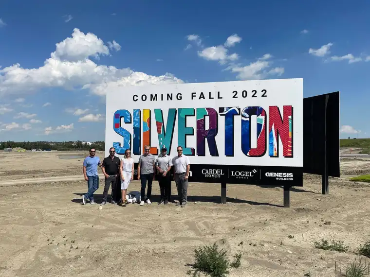 The Silverton development team posing in front of the Silverton sign.