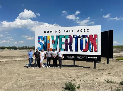 The Silverton development team posing in front of the Silverton sign.