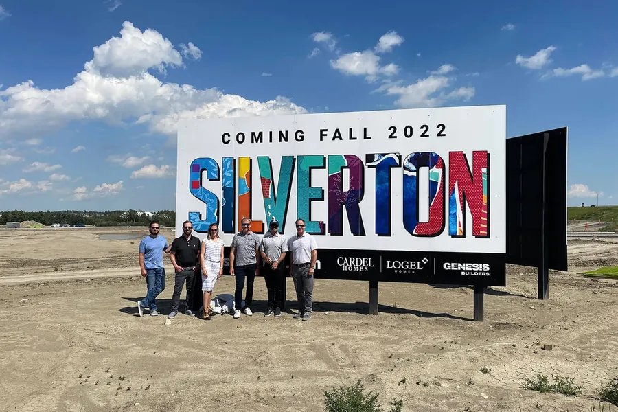 The Silverton development team posing in front of the Silverton sign.