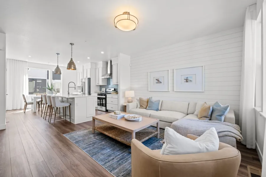 Open-concept living room and kitchen inside a modern Westminster Station townhome near Denver Colorado