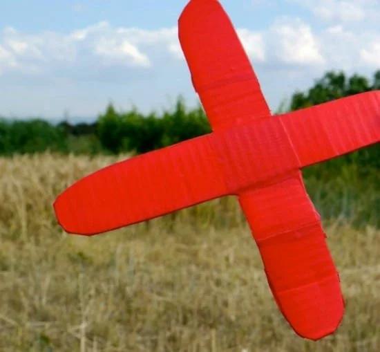 A red cardboard boomerang