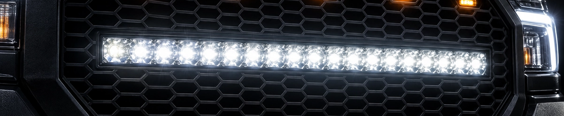 Flush-mounted LED light bars and amber grill markers on a custom off-road truck. Precision exterior lighting integration and 4x4 electrical upgrades for Texas drivers demanding clean, factory-like fitment.