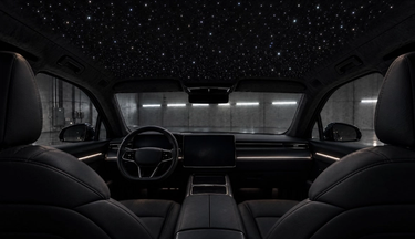 Custom starlight headliner installation and premium automotive lighting in Houston, Texas. Interior view of a luxury vehicle featuring a bespoke fiber optic star ceiling. Expert interior lighting upgrades for Teslas, exotics, and custom builds across