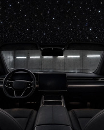 Custom starlight headliner installation and premium automotive lighting in Houston, Texas. Interior view of a luxury vehicle featuring a bespoke fiber optic star ceiling. Expert interior lighting upgrades for Teslas, exotics, and custom builds across