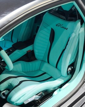Custom car seat retrim and leather upholstery repair in Houston, TX. Premium automotive leather, suede, and custom seat restoration for luxury vehicles and sports cars.
