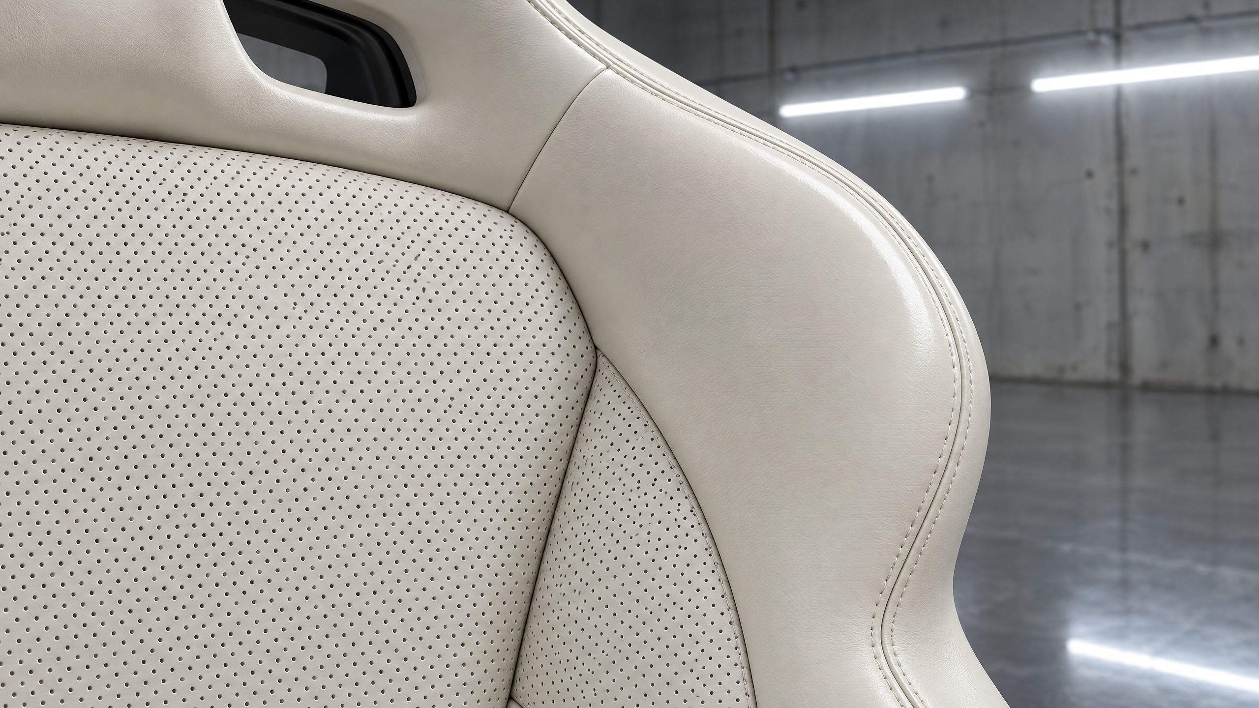 Custom ivory and off-white perforated leather car seats in Houston. High-end bucket seat upholstery, micro-perforations, and precision bolster wrapping for luxury vehicles.