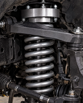 Off-road suspension leveling kits and heavy-duty coil spring upgrades for maximum ground clearance and aggressive stance. Precision suspension lifts utilizing durable components from ReadyLIFT, Rough Country, Eibach, and Dobinsons.