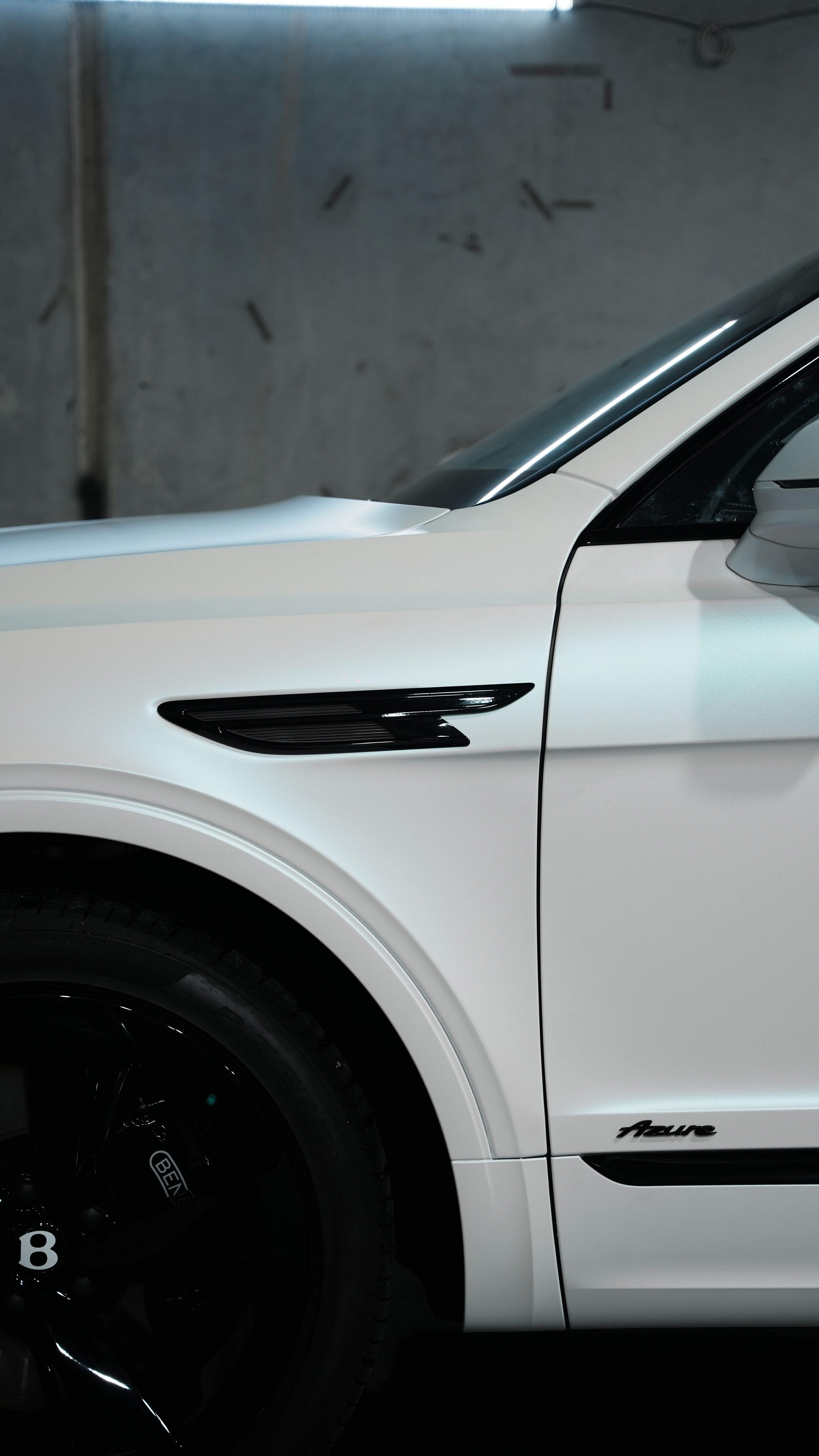 Badge and trim vehicle blackout package bentley. Automotive chrome delete and badge blackout services in Houston. Satin and gloss black vinyl wrap wrapping for window trim, door handles, and factory emblems.