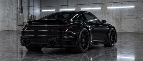 Complete gloss black trim blackout package on a high-performance sports coupe in Houston, Texas. Turnkey chrome delete, badge wrapping, and stealth exterior styling.