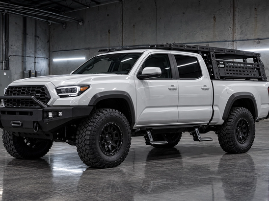 Custom truck accessories and off-road builds in Houston, Texas. Expert installation of heavy-duty bumpers, overland bed racks, and motorized power steps for lifted trucks across Katy, Sugar Land, and The Woodlands.
