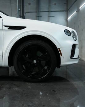 wheel blackout package for fully blacked out vehicle bentley betayanga. Custom wheel powder coating and brake caliper painting in Houston, near Katy and The Woodlands. Satin black wheel packages and stealth exterior detailing for custom car builds.