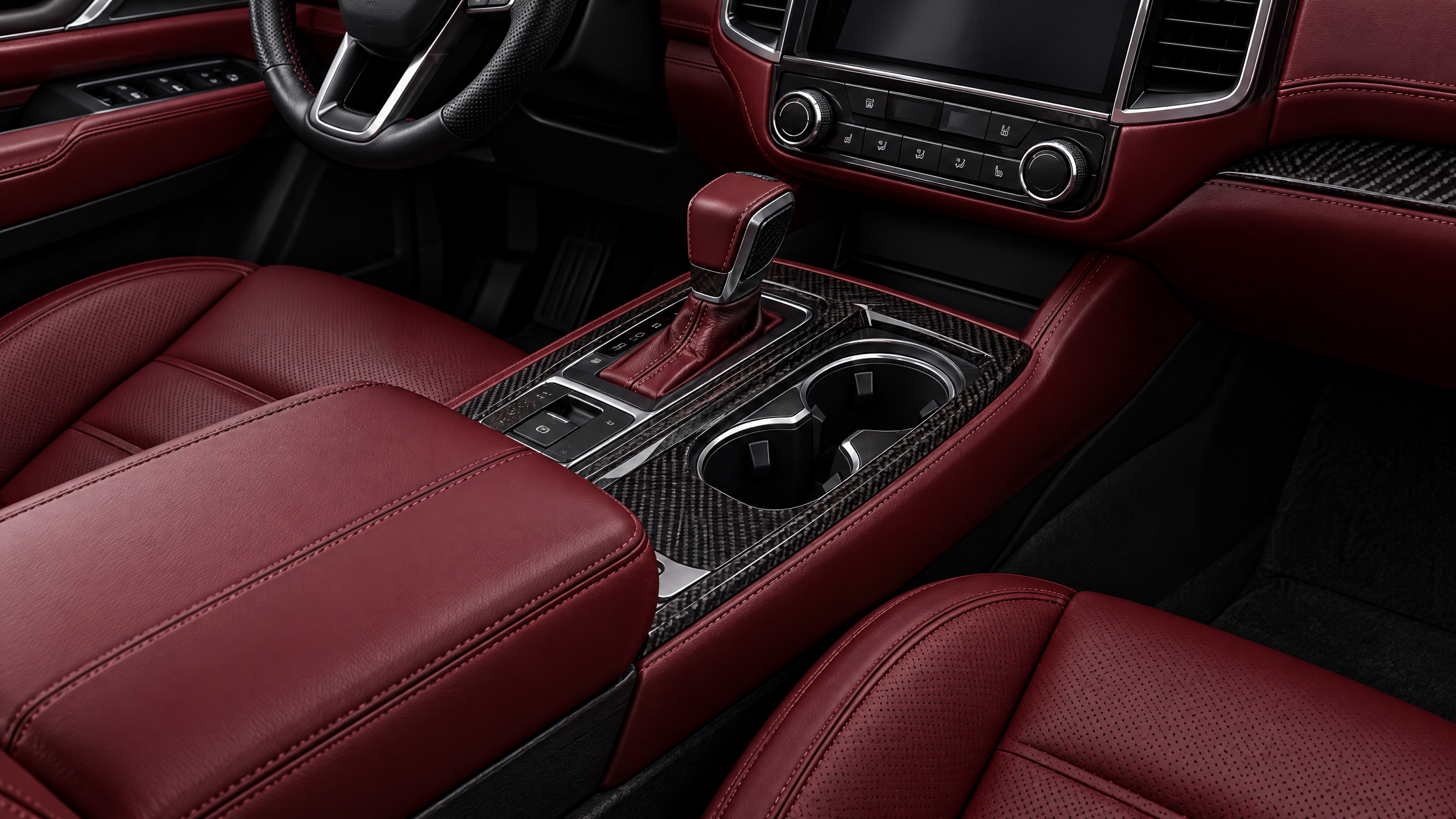 Deep garnet red leather interior and custom console wrapping in Houston, TX. Exotic red cabin styling and seamless trim integration for sports cars and luxury SUVs.