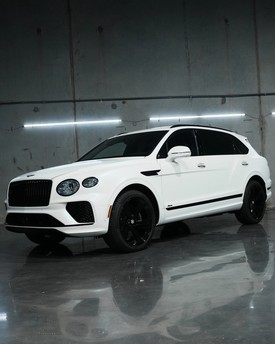 Fully blacked out Bentley vehicle consisting of a blackout package done in house. Complete vehicle blackout packages and full chrome deletes in Houston, TX. Professional gloss black trim conversions, badge blackouts, and window surround wrapping for high-end vehicles.