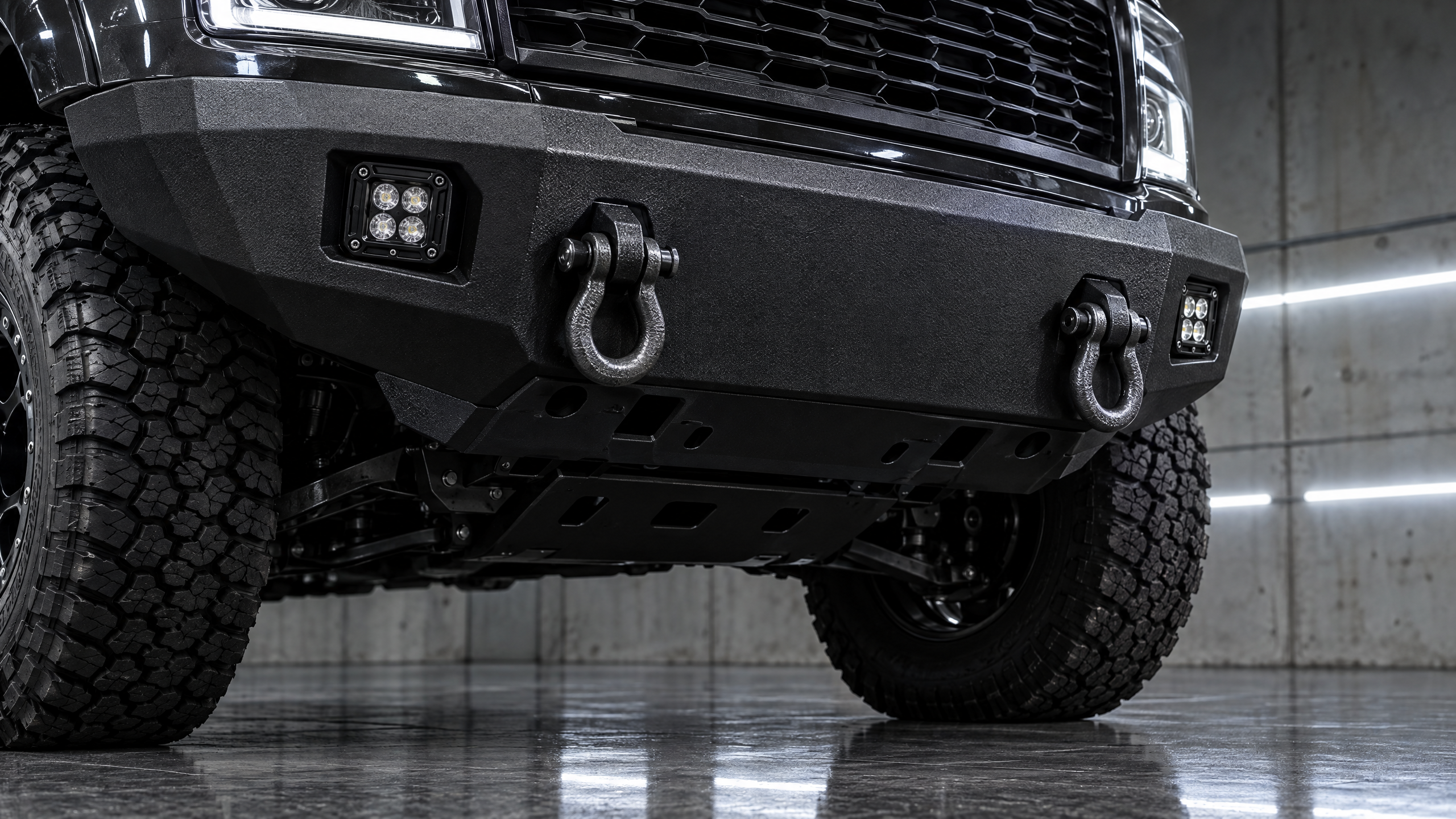 Heavy-duty steel off-road bumpers and front-end protection in Houston. Professional winch bumper and LED light bar integration for 4x4 trucks and SUVs in Texas.