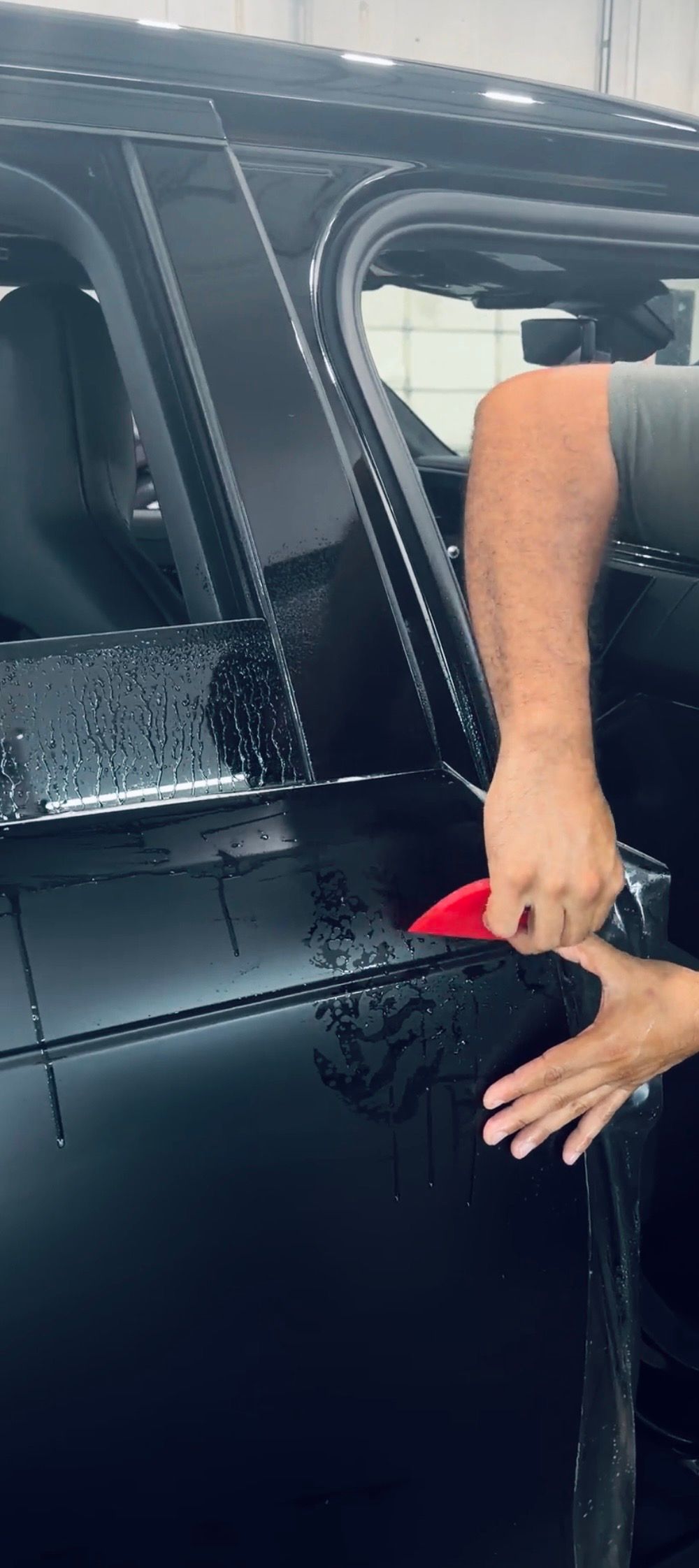 Custom high-touch panel PPF wrapping near Katy and The Woodlands. Targeted paint protection film for door cups, side mirrors, rocker panels, and rear trunk ledges.