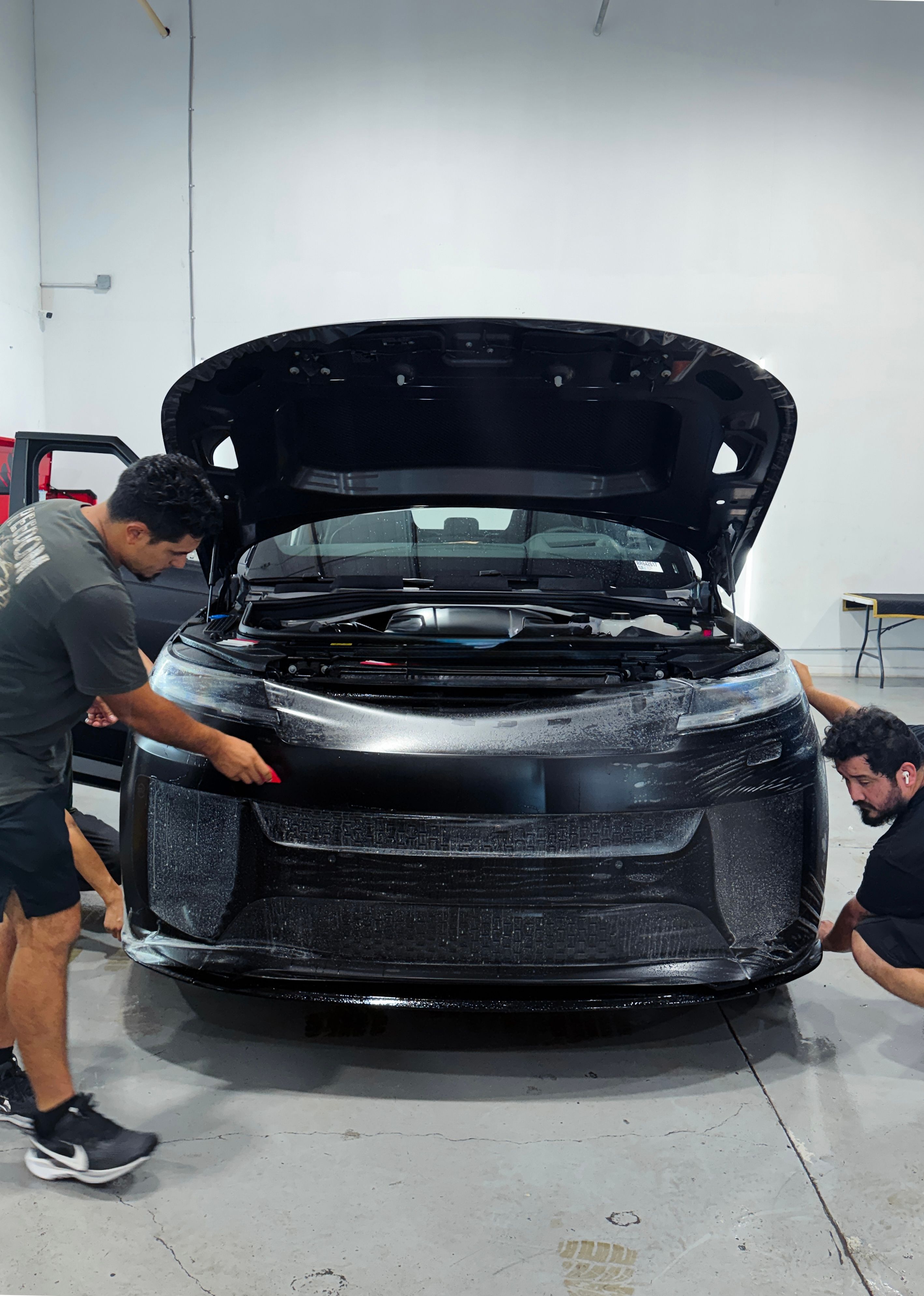 Full front paint protection film packages in Houston, TX. Clear bra installation covering high-impact front bumpers, hoods, and fenders for luxury vehicles and sports cars.